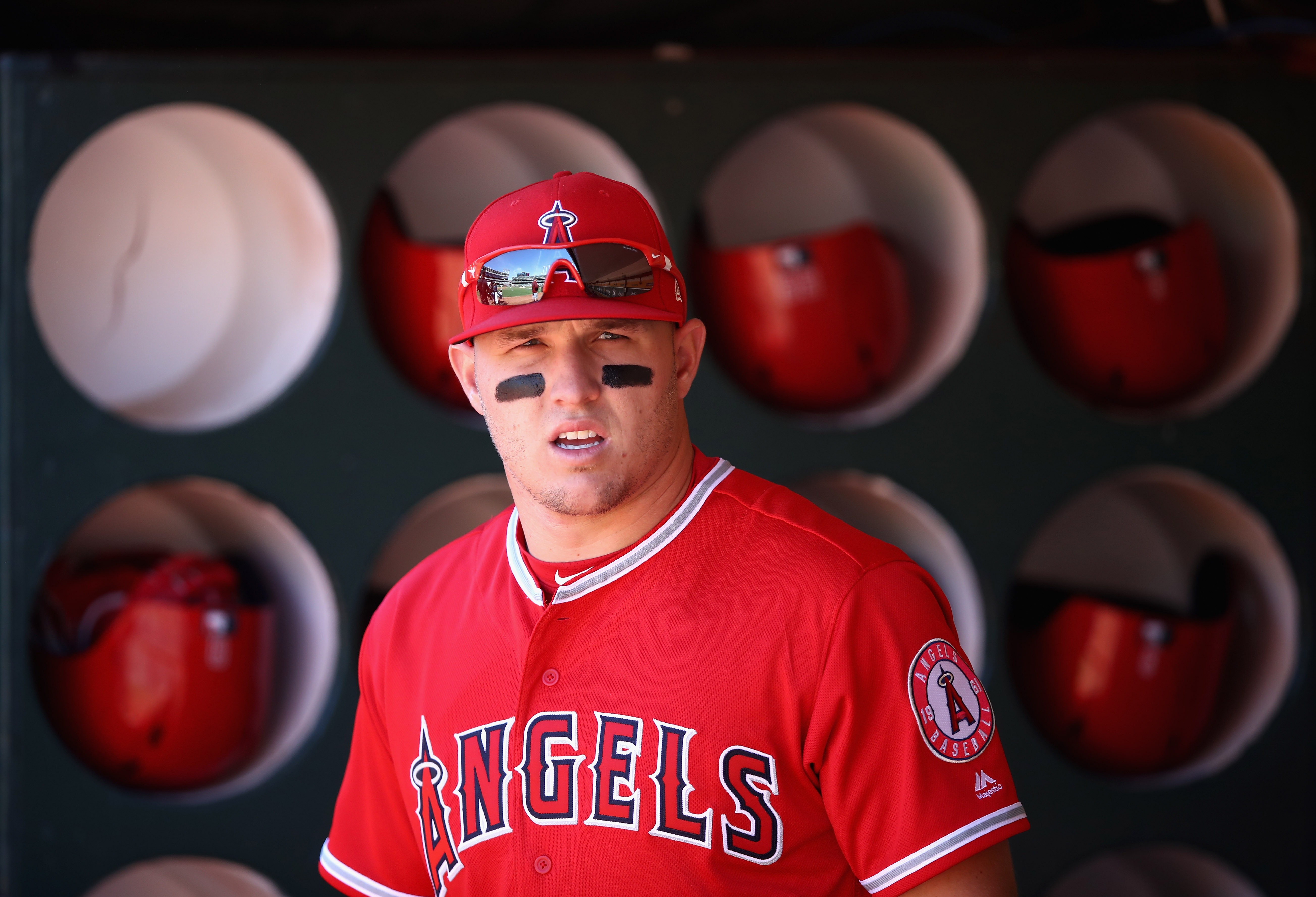 Mike Trout #27 of the Los Angeles Angels stands in the dugout before their game against the Oakland Athletics at Oakland Alameda Coliseum on March 29, 2018 in Oakland, California. (Photo by Ezra Shaw/Getty Images)