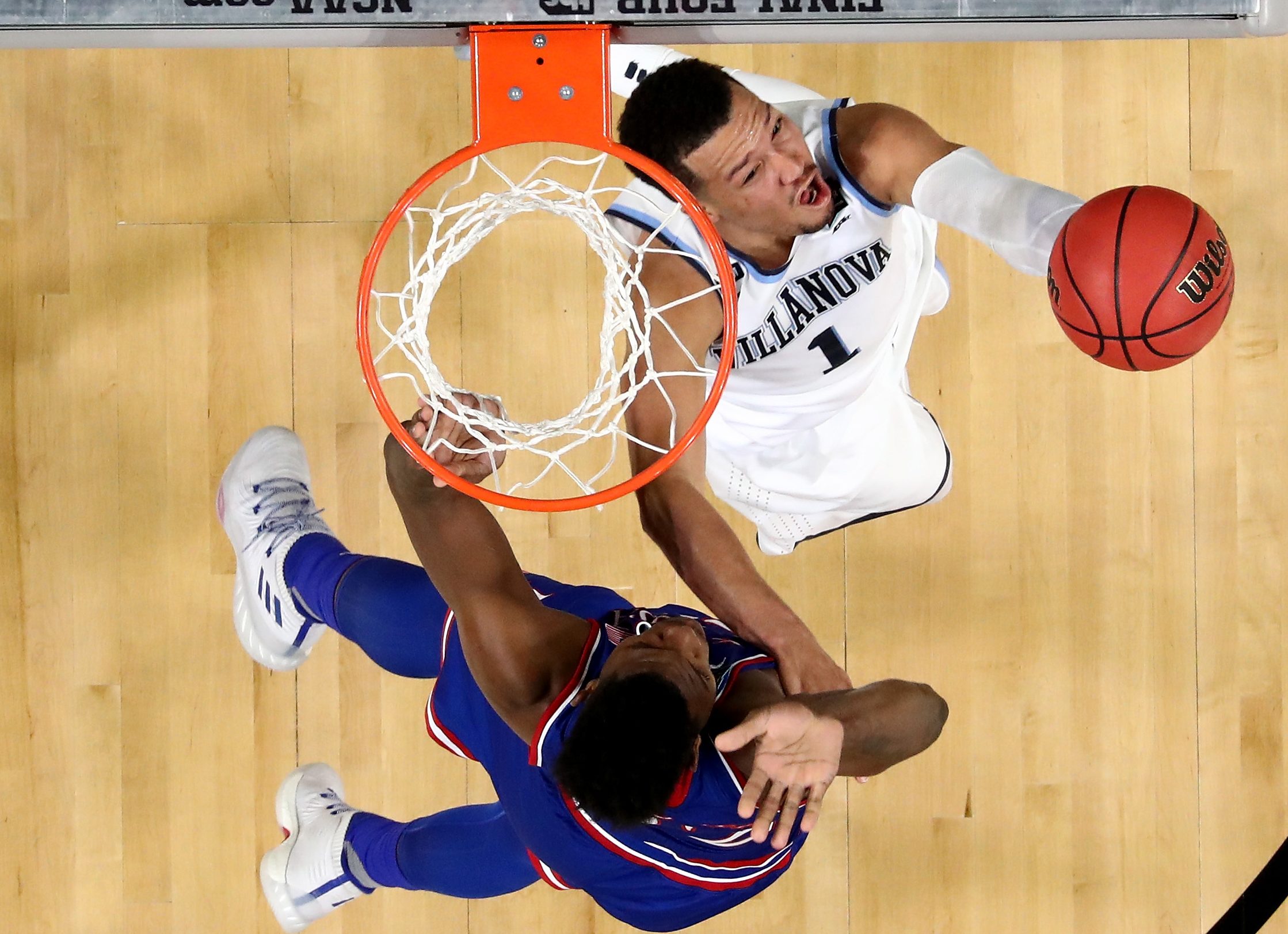 Jalen Brunson #1 of the Villanova Wildcats drives to the basket against Silvio De Sousa #22 of the Kansas Jayhawks during the 2018 NCAA Men's Final Four Semifinal at the Alamodome on March 31, 2018 in San Antonio, Texas.  (Photo by Ronald Martinez/Getty Images)