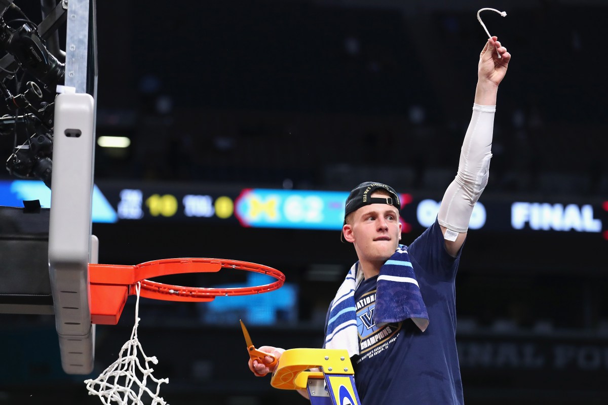 Donte DiVincenzo #10 of the Villanova Wildcats cuts down the net after defeating the Michigan Wolverines during the 2018 NCAA Men's Final Four National Championship game at the Alamodome on April 2, 2018 in San Antonio, Texas. Villanova defeated Michigan 79-62.  (Photo by Tom Pennington/Getty Images)