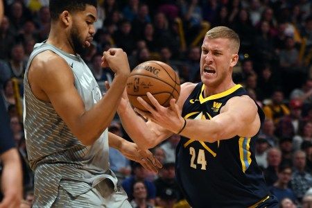 Denver Nuggets center Mason Plumlee (24) just about loses control of the ball as Minnesota Timberwolves center Karl-Anthony Towns (32) swipes at it during the second quarter on April 5, 2018 at Pepsi Center. (Photo by John Leyba/The Denver Post via Getty Images)