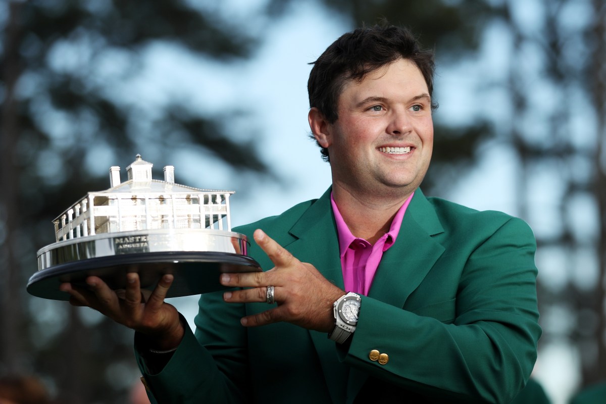 Patrick Reed of the United States celebrates with the trophy during the green jacket ceremony after winning the 2018 Masters Tournament at Augusta National Golf Club on April 8, 2018 in Augusta, Georgia.  (Photo by Patrick Smith/Getty Images)