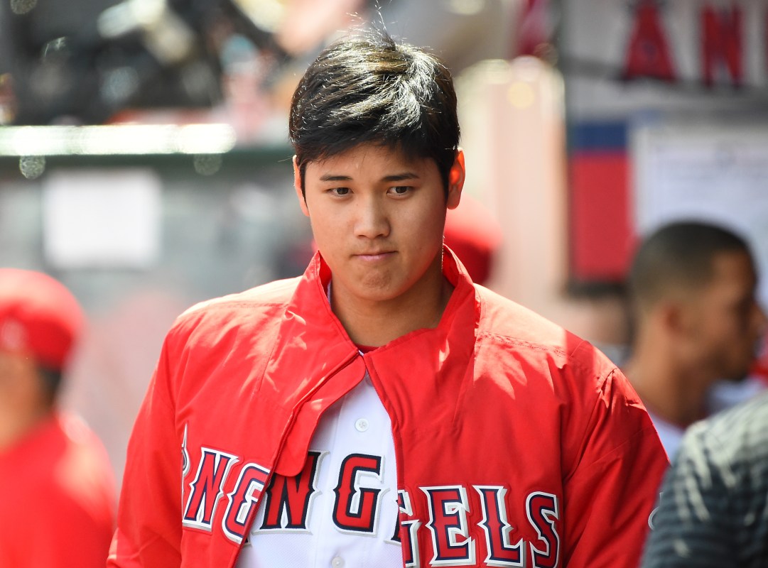 Shohei Ohtani #17 of the Los Angeles Angels sits in the dugout during the game against the Oakland Athletics at Angel Stadium on April 8, 2018 in Anaheim, California.  (Photo by Jayne Kamin-Oncea/Getty Images)
