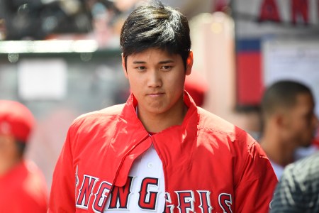 Shohei Ohtani #17 of the Los Angeles Angels sits in the dugout during the game against the Oakland Athletics at Angel Stadium on April 8, 2018 in Anaheim, California.  (Photo by Jayne Kamin-Oncea/Getty Images)