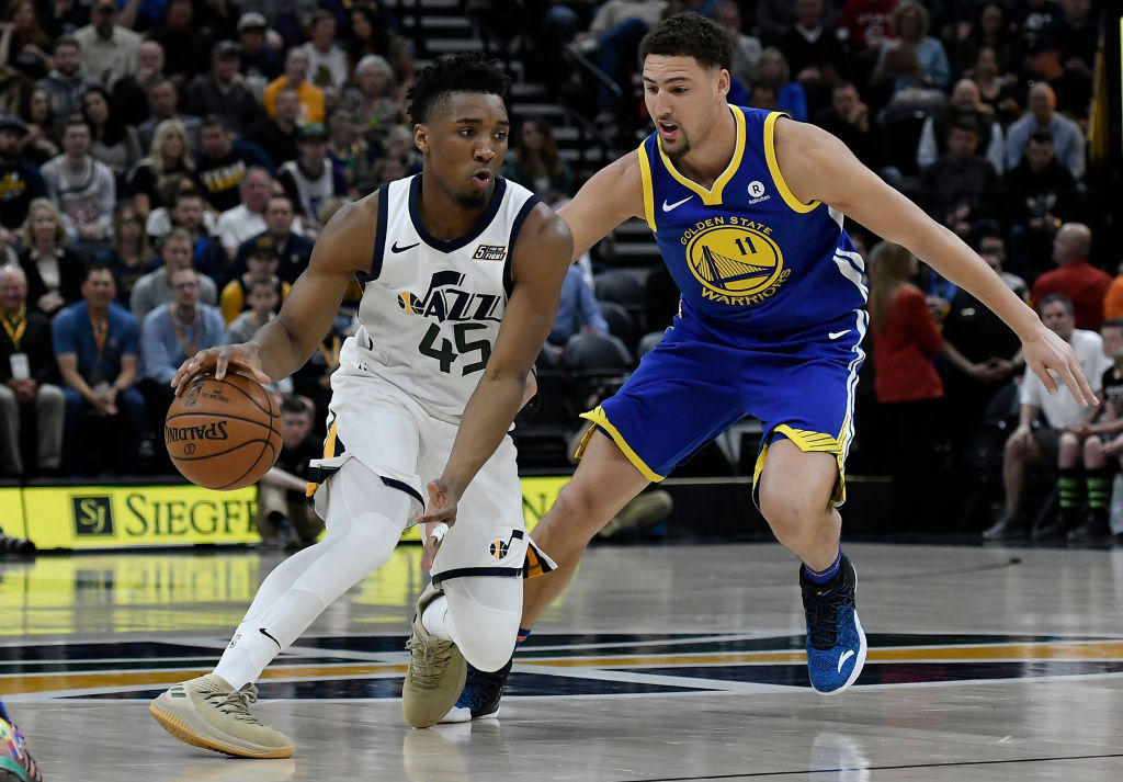 Donovan Mitchell #45 of the Utah Jazz drives against Klay Thompson #11 of the Golden State Warriors in the first half of a game at Vivint Smart Home Arena on April 10, 2018 in Salt Lake City, Utah. (Photo by Gene Sweeney Jr./Getty Images)
