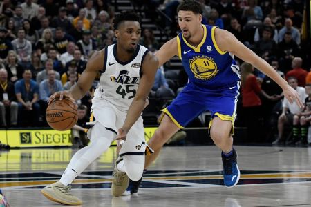 Donovan Mitchell #45 of the Utah Jazz drives against Klay Thompson #11 of the Golden State Warriors in the first half of a game at Vivint Smart Home Arena on April 10, 2018 in Salt Lake City, Utah. (Photo by Gene Sweeney Jr./Getty Images)
