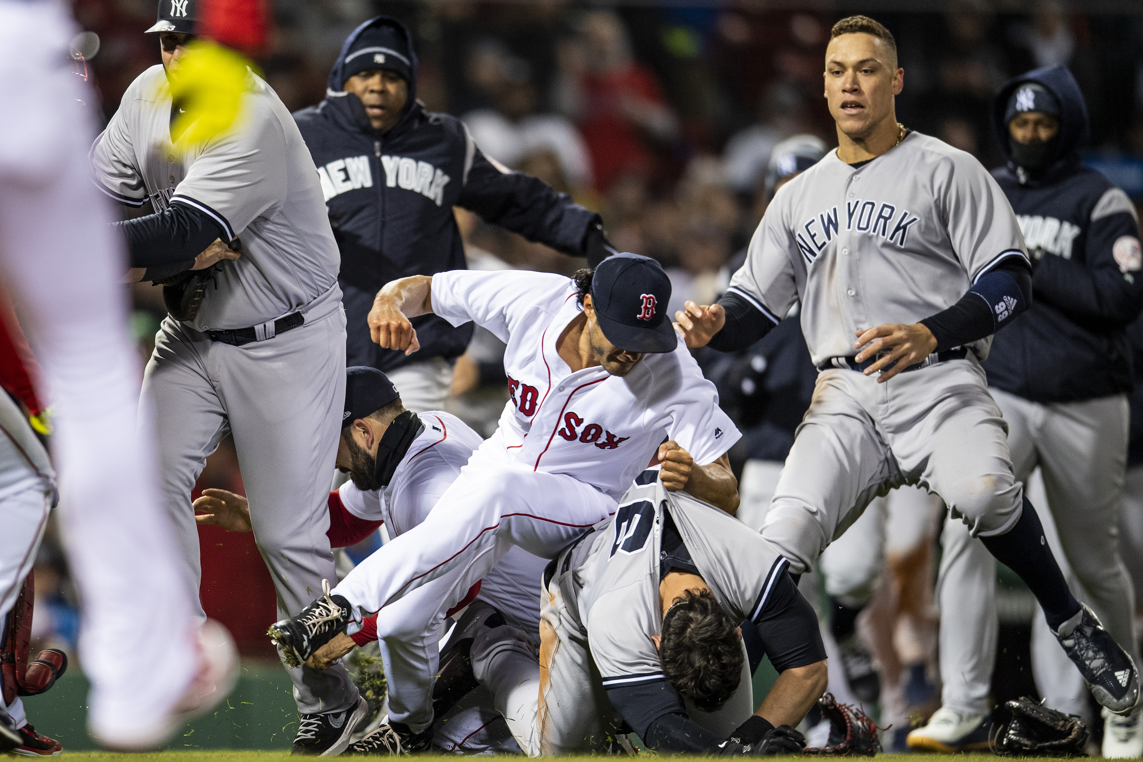 Tyler Austin #26 of the New York Yankees fights with Joe Kelly #46 of the B...