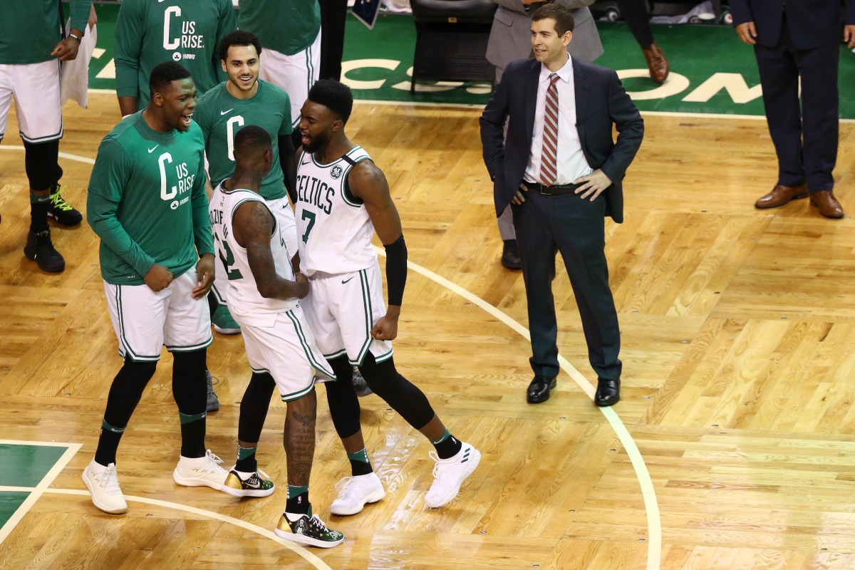 Terry Rozier #12 of the Boston Celtics celebrates with Jaylen Brown #7 during the fourth quarter of Game One of Round One of the 2018 NBA Playoffs against the Milwaukee Bucks during at TD Garden on April 15, 2018 in Boston, Massachusetts. (Photo by Maddie Meyer/Getty Images)
