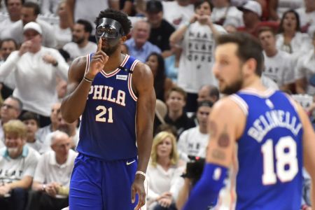 Joel Embiid #21 of the Philadelphia 76ers reacts after hitting a three pointer in the second quarter against the Miami Heat at American Airlines Arena on April 19, 2018 in Miami, Florida. (Photo by Eric Espada/Getty Images)