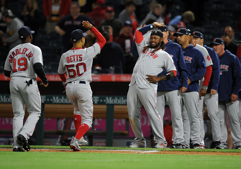 Boston Red Sox designated hitter Hanley Ramirez (13) waits to greet right fielder Mookie Betts (50) after the Red Sox defeated the Los Angeles Angels of Anaheim 8 to 2 in a game played on April 19, 2018 at Angel Stadium of Anaheim in Anaheim, CA. (Photo by John Cordes/Icon Sportswire via Getty Images)