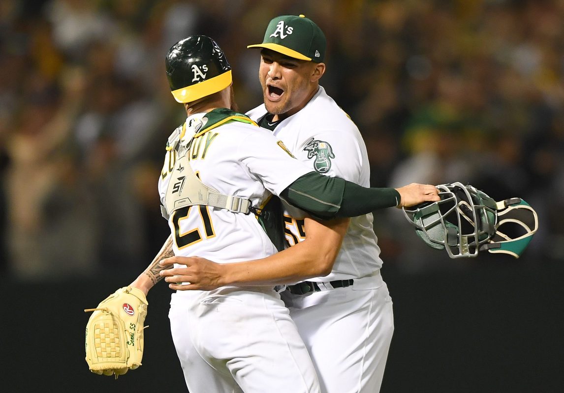 Sean Manaea #55 and Jonathan Lucroy #21 of the Oakland Athletics celebrates after Manaea pitched a no-hitter against the Boston Red Sox at the Oakland Alameda Coliseum on April 21, 2018 in Oakland, California. The Athletics won the game 3-0.  (Photo by Thearon W. Henderson/Getty Images)