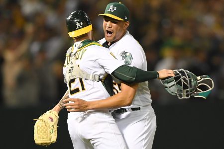 Sean Manaea #55 and Jonathan Lucroy #21 of the Oakland Athletics celebrates after Manaea pitched a no-hitter against the Boston Red Sox at the Oakland Alameda Coliseum on April 21, 2018 in Oakland, California. The Athletics won the game 3-0.  (Photo by Thearon W. Henderson/Getty Images)