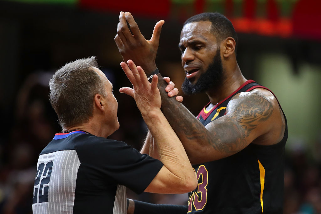 LeBron James #23 of the Cleveland Cavaliers discusses a non foul call with referee Bill Spooner while playing the Indiana Pacers in Game Five of the Eastern Conference Quarterfinals during the 2018 NBA Playoffs at Quicken Loans Arena on April 25, 2018 in Cleveland, Ohio. Cleveland won the game 98-95 to take a 3-2 series lead. NOTE TO USER: User expressly acknowledges and agrees that, by downloading and or using this photograph, User is consenting to the terms and conditions of the Getty Images License Agreement. (Photo by Gregory Shamus/Getty Images)