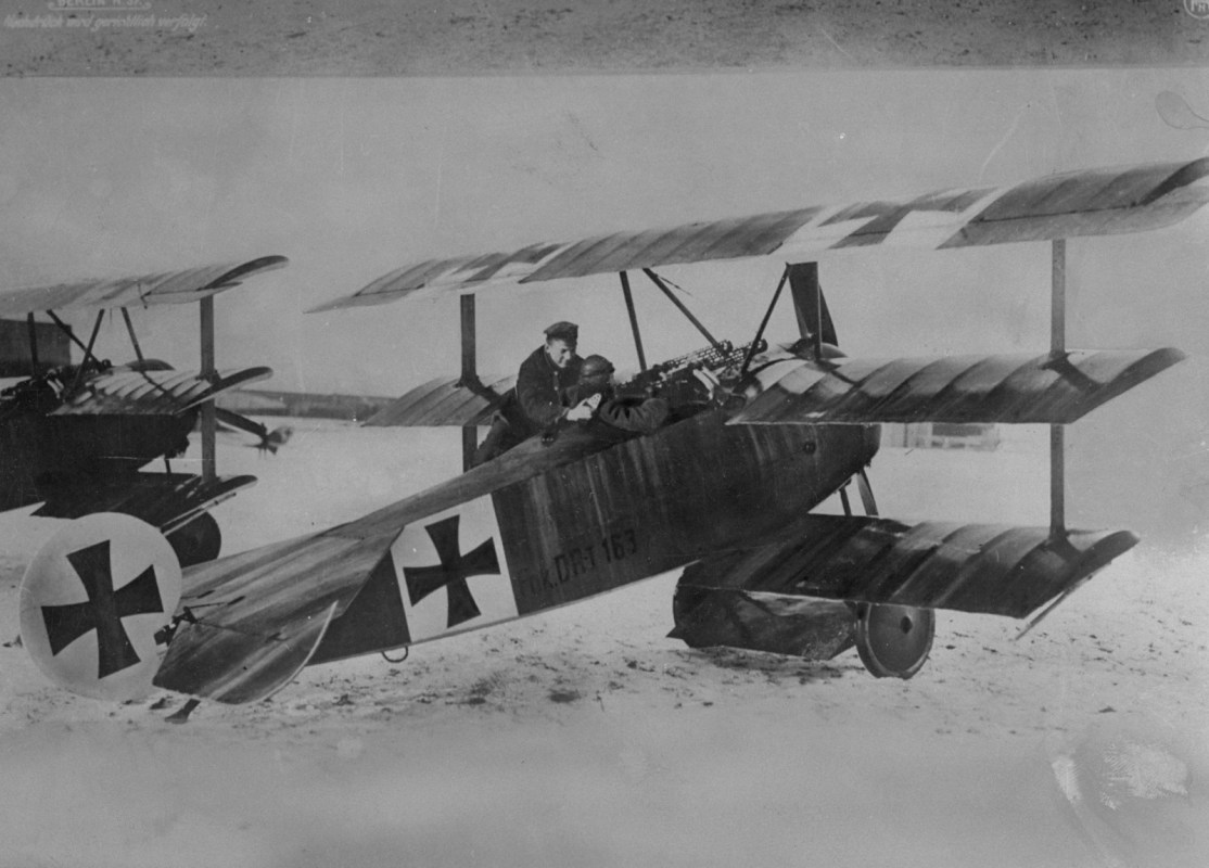 World War I German flying ace Baron von Richthofen (the "Red Baron") with one of his aircraft, a triplane. (Time Life Pictures/Mansell/The LIFE Picture Collection/Getty Images)