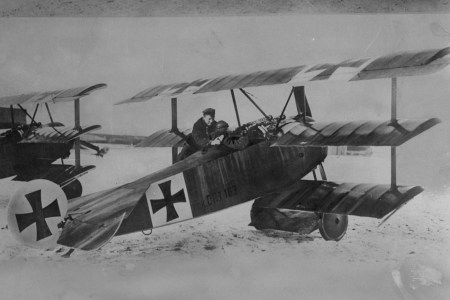 World War I German flying ace Baron von Richthofen (the "Red Baron") with one of his aircraft, a triplane. (Time Life Pictures/Mansell/The LIFE Picture Collection/Getty Images)