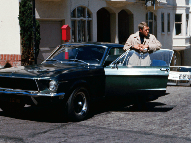 American actor Steve McQueen (1930 - 1980) as Frank Bullit next to a Ford Mustang 390 GT 2+2 Fastback in the american crime thriller movie 'Bullitt', San Francisco, 1968. (Photo by Silver Screen Collection/Getty Images)