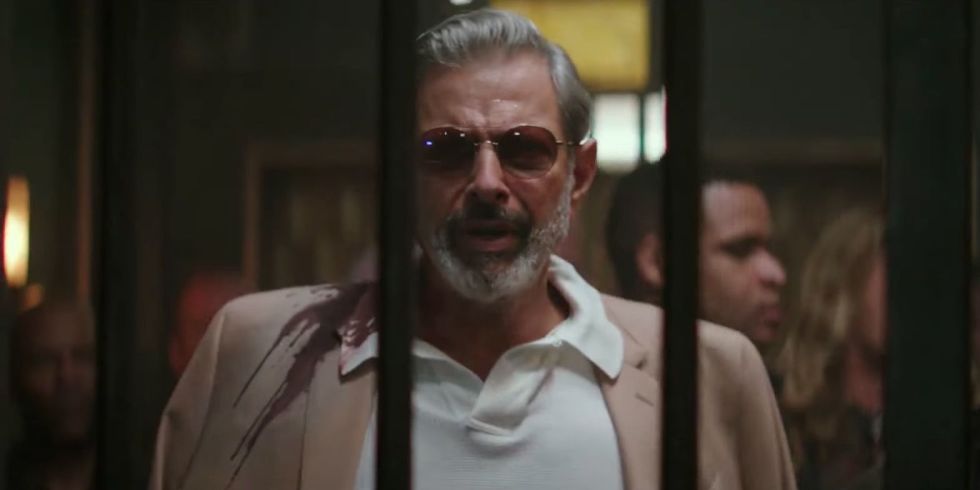 Jeff Goldblum is spattered in blood as he arrives at 'Hotel Artemis' in the brand new trailer. (YouTube) 
