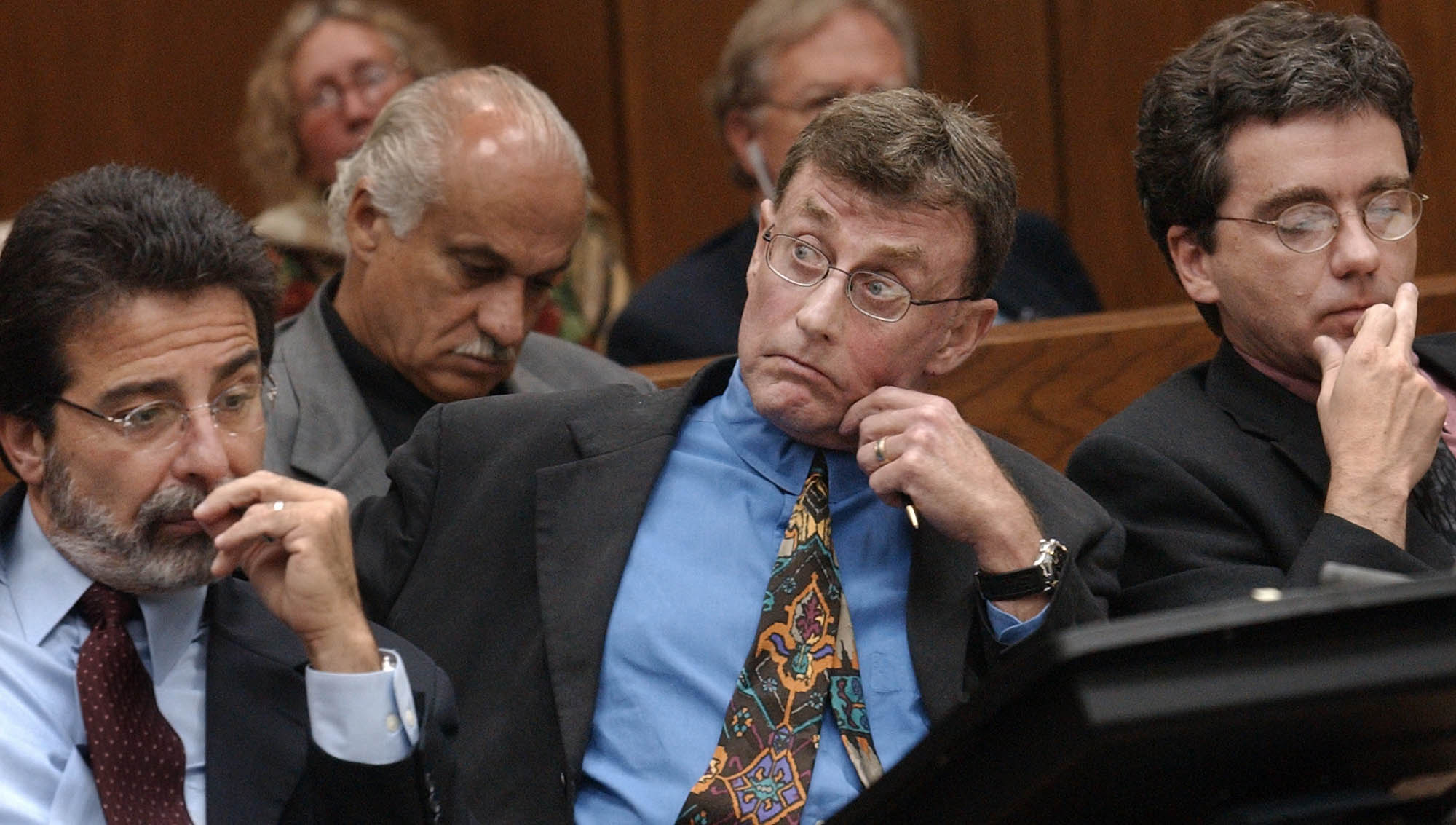 Michael Peterson watches as prosecutor David Saacks, not pictured, argues why gay pornography and e-mail soliciting sex with another man taken from Peterson's home computer should be presented to the jury during Peterson's murder trial, Thursday Aug. 7, 2003, in Durham, N.C. (AP Photo/Chuck Liddy, Pool)