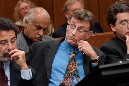 Michael Peterson watches as prosecutor David Saacks, not pictured, argues why gay pornography and e-mail soliciting sex with another man taken from  Peterson's home computer should be presented to the jury during Peterson's murder trial, Thursday Aug. 7, 2003, in Durham, N.C. (AP Photo/Chuck Liddy, Pool)