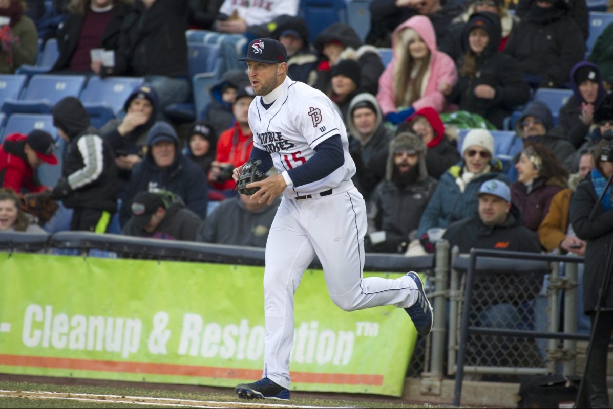 Tim Tebow (15) runs onto the field during his debut with the Binghamton Rumble Ponies, against the Portland Sea Dogs in a Double-A baseball game Thursday, April 5, 2018, in Binghamton, N.Y. (AP Photo/Matt Smith)