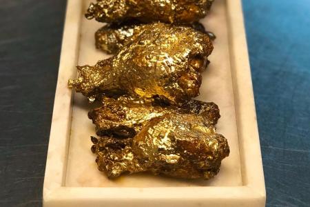 The 24-karat wings from The Ainsworth. (via The Ainsworth and @foodninfo on Instagram)