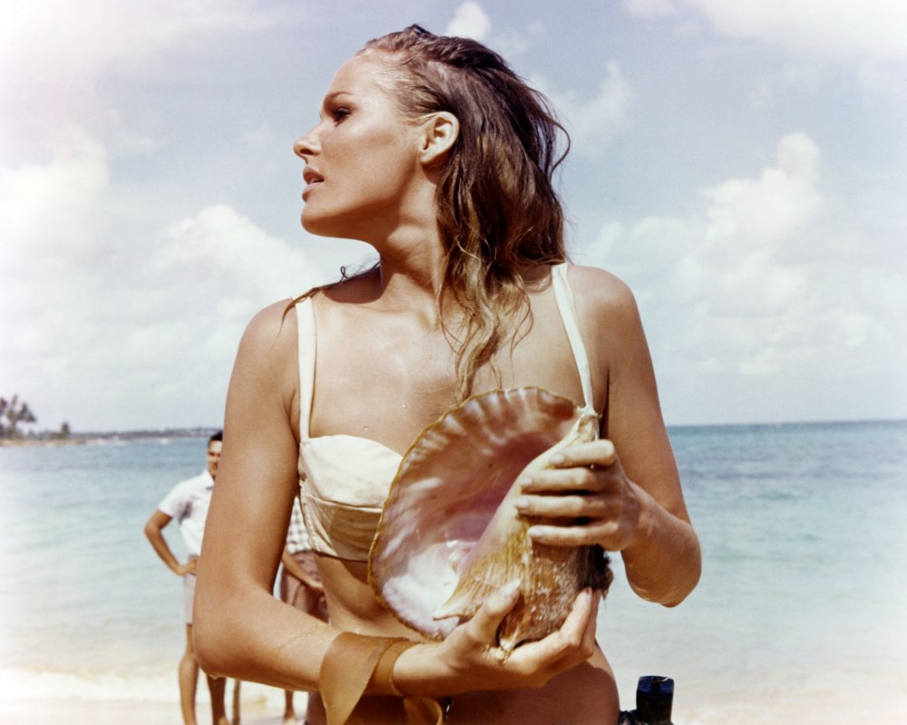 Ursula Andress, Swedish actress, wearing a white bikini and holding a conch shell in a publicity still issued for the film, 'Dr No', 1962. The James Bond film, directed by  Terence Young (1915-1994), starred Andress as 'Honey Ryder'. (Photo by Silver Screen Collection/Getty Images)  (Photo by Silver Screen Collection/Getty Images)