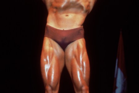 Austrian born actor and former bodybuilder Arnold Schwarzenegger poses in a bathing suit and flexes his muscles in a bodybuilding pose, circa 1980. (Photo by Hulton Archive/Getty Images)