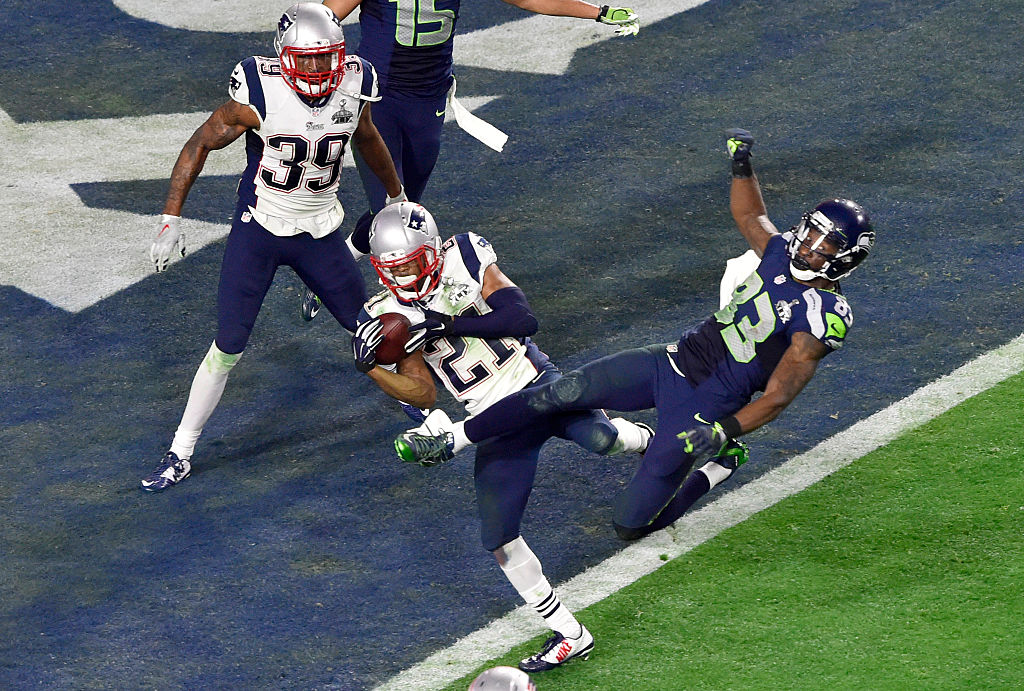 Malcolm Dutler #21 of the New England Patriots intercepts the pass at the goal line late in the fourth quarter against the Seattle Seahawks during Super Bowl XLIX February 1, 2015 at the University of Phoenix Stadium in Glendale, Arizona. The Patriots won the game 28-24.  (Photo by Focus on Sport/Getty Images)