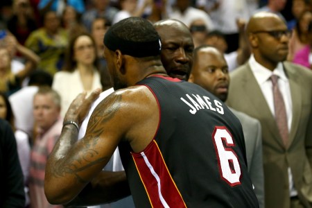 LeBron James #6 of the Miami Heat hugs Michael Jordan after defeating the Charlotte Bobcats 109-98 in Game Four of the Eastern Conference Quarterfinals during the 2014 NBA Playoffs at Time Warner Cable Arena on April 28, 2014 in Charlotte, North Carolina. (Photo by Streeter Lecka/Getty Images)