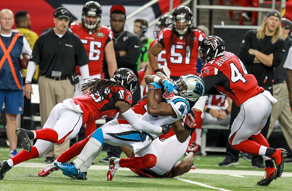 Carolina Panthers running back Fozzy Whittaker (43) is tackled before getting a first down during the first quarter of the NFL game between the Carolina Panthers and the Atlanta Falcons. Atlanta upsets Carolina 20-13 at the Georgia Dome in Atlanta, GA. (Photos by Frank Mattia/Icon Sportswire) (Photo by Frank Mattia/Icon Sportswire/Corbis via Getty Images)