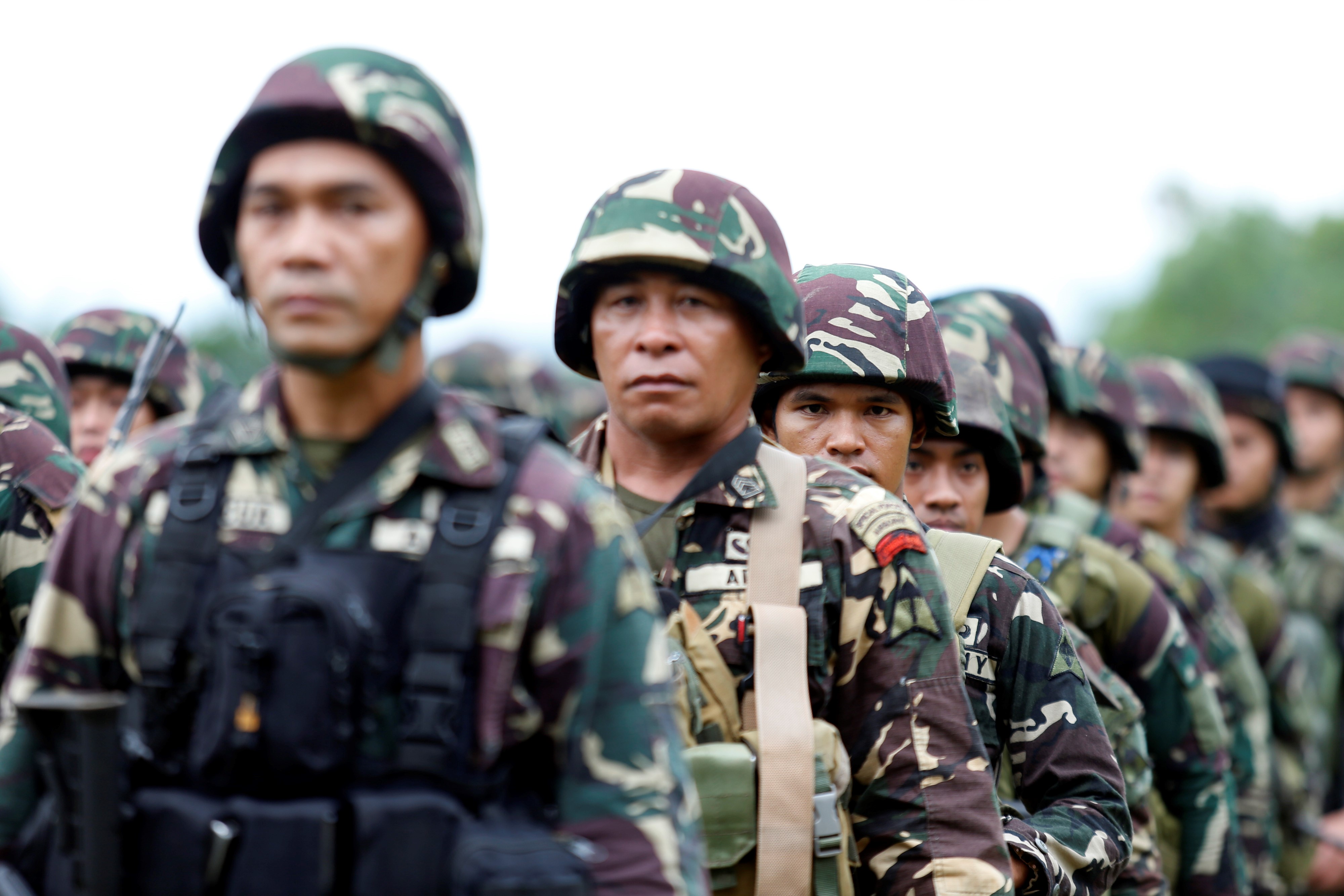 Philippine soldiers are lined up during their send off ceremony in Marawi, Lanao del Sur in the Southern Philippines on October 25, 2017. The military showed to media the destructions brought by the siege that left 165 soldiers, over 900 militants, and 47 civilians, dead. (Jeoffrey Maitem/Anadolu Agency/Getty Images)