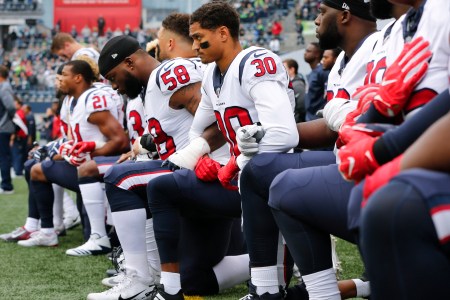 Members of the Houston Texans, including Kevin Johnson #30 and Lamarr Houston #58, kneel during the national anthem before the game at CenturyLink Field on October 29, 2017 in Seattle, Washington.  (Jonathan Ferrey/Getty Images)