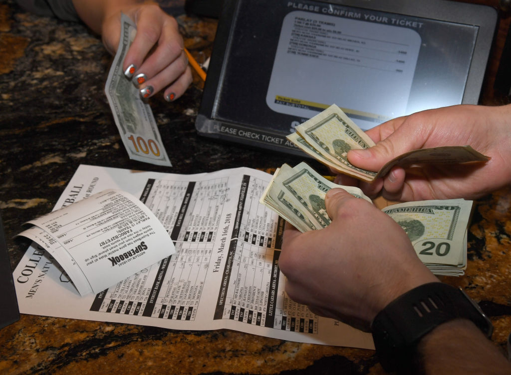 Jake Sindberg of Wisconsin makes bets during a viewing party for the NCAA Men's College Basketball Tournament inside the 25,000-square-foot Race & Sports SuperBook at the Westgate Las Vegas Resort & Casino which features 4,488-square-feet of HD video screens on March 15, 2018 in Las Vegas, Nevada.  (Photo by Ethan Miller/Getty Images)