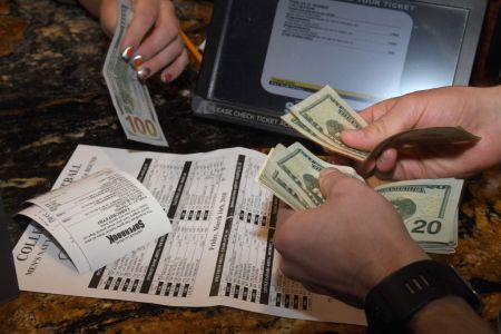 Jake Sindberg of Wisconsin makes bets during a viewing party for the NCAA Men's College Basketball Tournament inside the 25,000-square-foot Race & Sports SuperBook at the Westgate Las Vegas Resort & Casino which features 4,488-square-feet of HD video screens on March 15, 2018 in Las Vegas, Nevada.  (Photo by Ethan Miller/Getty Images)