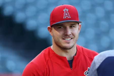 Mike Trout #27 of the Los Angeles Angels of Anaheim looks on during batting practice prior to the MLB game against the Boston Red Sox at Angel Stadium on April 19, 2018 in Anaheim, California. The Red Sox defeated the Angels 8-2.  (Photo by Victor Decolongon/Getty Images)