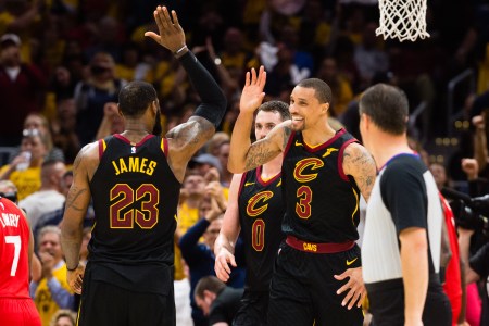 LeBron James #23 of the Cleveland Cavaliers celebrates with George Hill #3 after Hill scored during the second half of Game 4 of the second round of the Eastern Conference playoffs against the Toronto Raptors at Quicken Loans Arena on May 7, 2018 in Cleveland, Ohio. The Cavaliers defeated the Raptors 128-93. (Photo by Jason Miller/Getty Images)