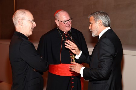 Fr. James Martin, Cardinal Timothy Dolan, George Clooney attend the" Heavenly Bodies: Fashion & The Catholic Imagination Costume Institute Gala at The Metropolitan Museum of Art on May 7, 2018.  (Kevin Mazur/MG18/Getty Images for The Met Museum/Vogue)