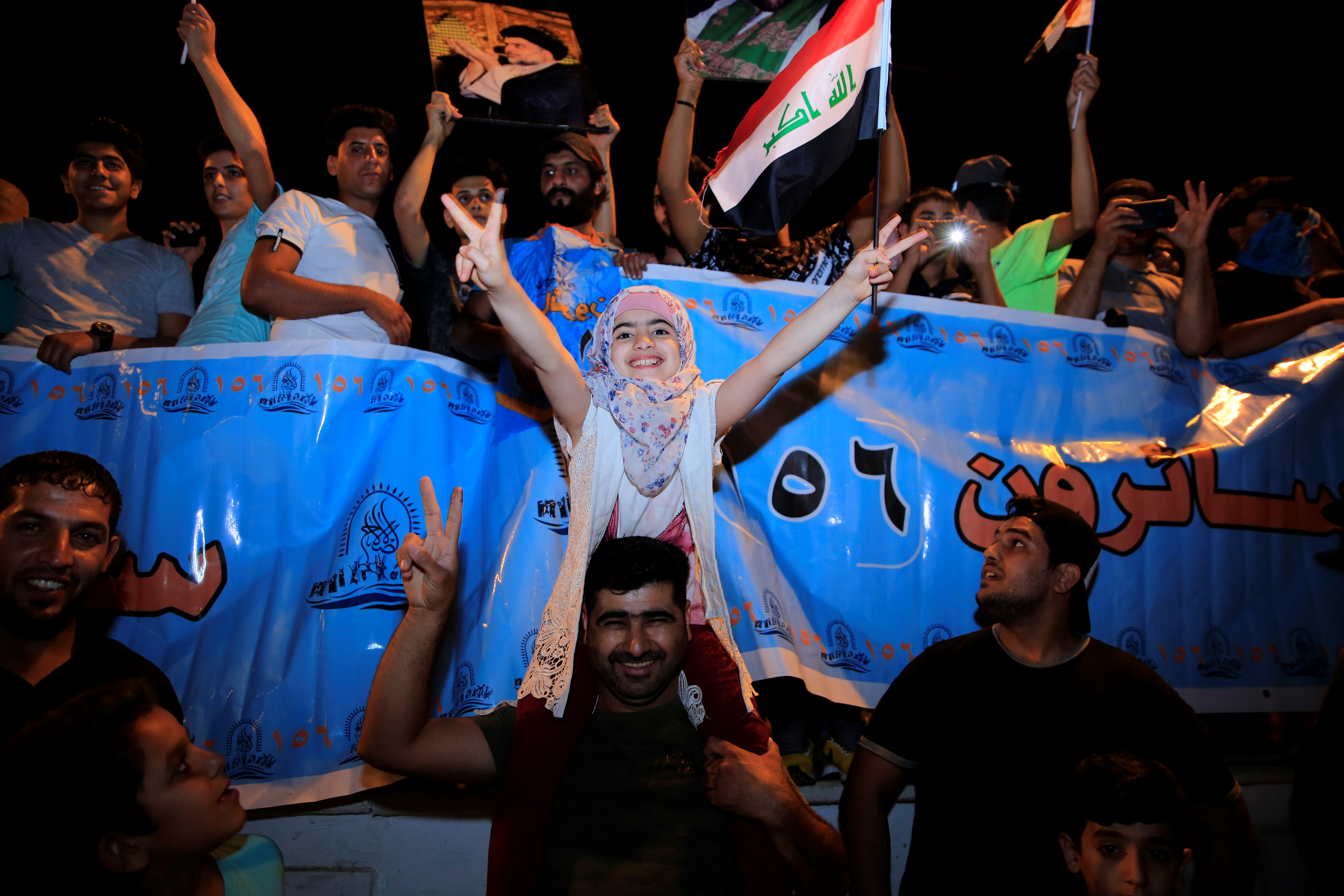 Supporters of Iraqi Shiite cleric Moqtada al-Sadr celebrate the results of the parliamentary election at the Tahrir Square, Baghdad, Iraq.
(Murtadha Sudani/Anadolu Agency/Getty Images)