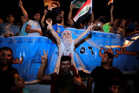 Supporters of Iraqi Shiite cleric Moqtada al-Sadr celebrate the results of the parliamentary election at the Tahrir Square, Baghdad, Iraq.
 (Murtadha Sudani/Anadolu Agency/Getty Images)