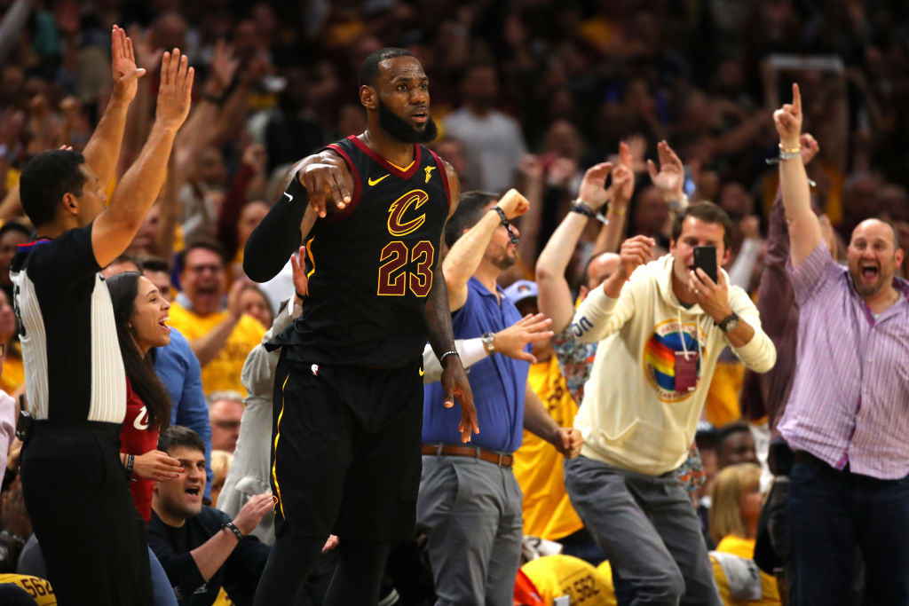 Fans react after LeBron James #23 of the Cleveland Cavaliers makes a basket late in the game against the Boston Celtics during Game Four of the 2018 NBA Eastern Conference Finals at Quicken Loans Arena on May 21, 2018 in Cleveland, Ohio.