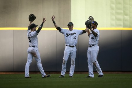 Ryan Braun #8, Christian Yelich #22 and Domingo Santana #16 of the Milwaukee Brewers celebrate after beating the New York Mets 17-6 at Miller Park on May 26, 2018 in Milwaukee, Wisconsin. (Photo by Dylan Buell/Getty Images)