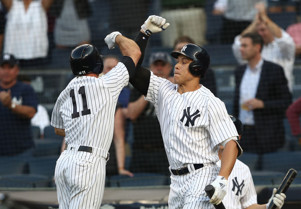 Brett Gardner #11 of the New York Yankees celebrates his home run with Aaron Judge #99 against the Houston Astros in the first inning during their game at Yankee Stadium on May 29, 2018 in New York City.  (Photo by Al Bello/Getty Images)