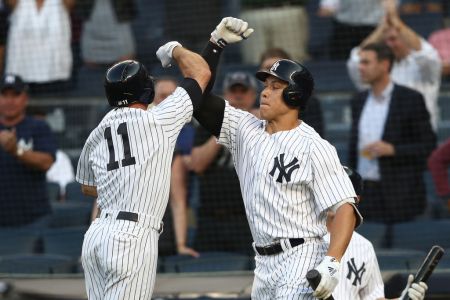 Brett Gardner #11 of the New York Yankees celebrates his home run with Aaron Judge #99 against the Houston Astros in the first inning during their game at Yankee Stadium on May 29, 2018 in New York City.  (Photo by Al Bello/Getty Images)
