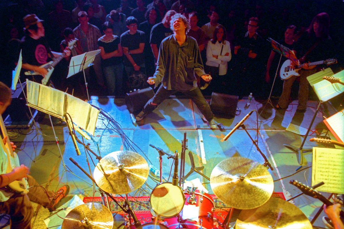Glenn Branca conducting his ensemble at the Anchorage in Brookyn on Thursday night, July 20, 2000.(Hiroyuki Ito/Getty Images)
