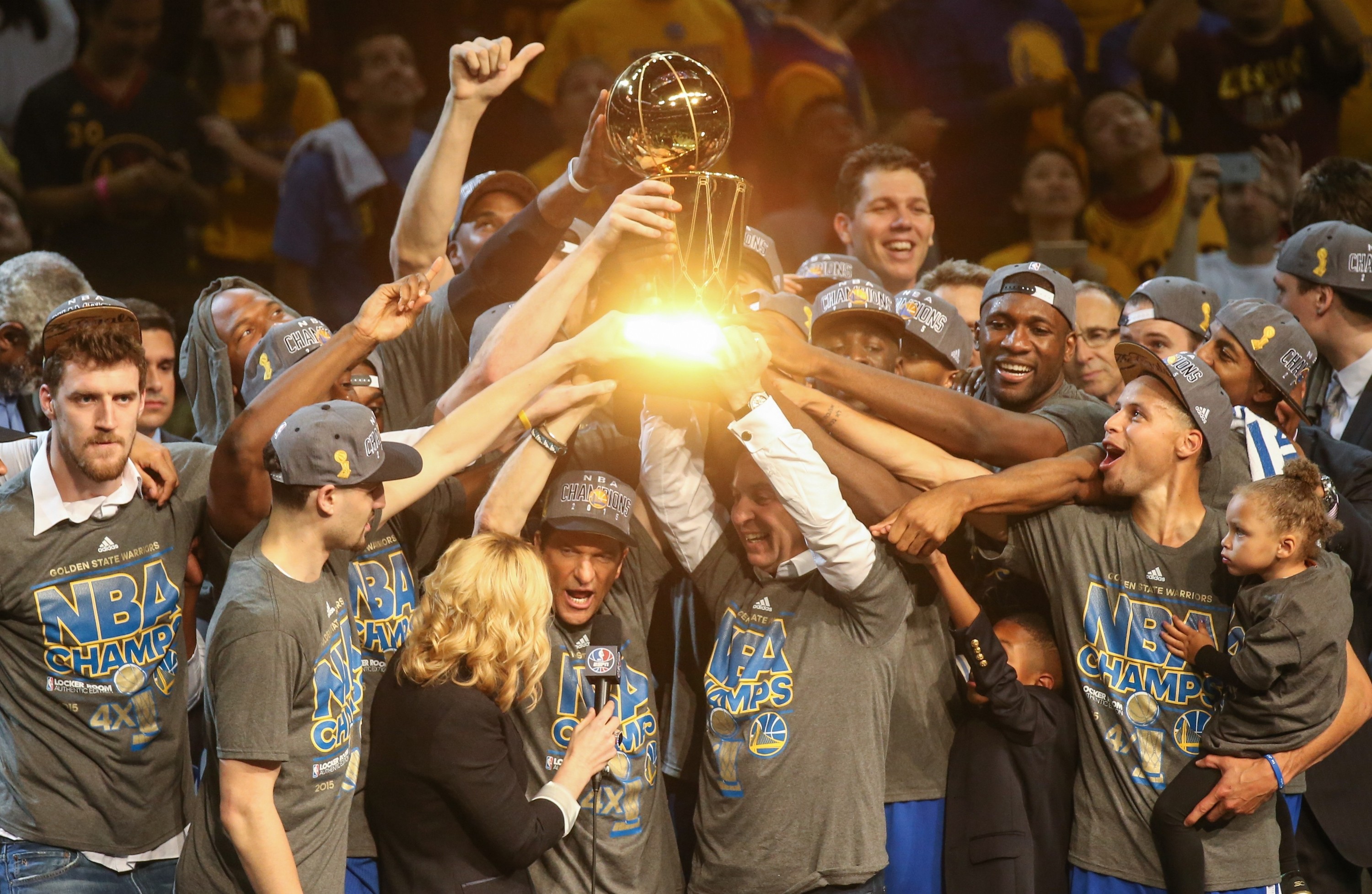 Golden State Warriors players celebrate with Larry O'Brien Championship Trophy after winning Game Six of the 2015 NBA Finals against the Cleveland Cavaliers in Cleveland, Ohio, USA, on June 16, 2015, starting a run of two titles and three consecutive Finals. (Cem Ozdel/Anadolu Agency/Getty Images)