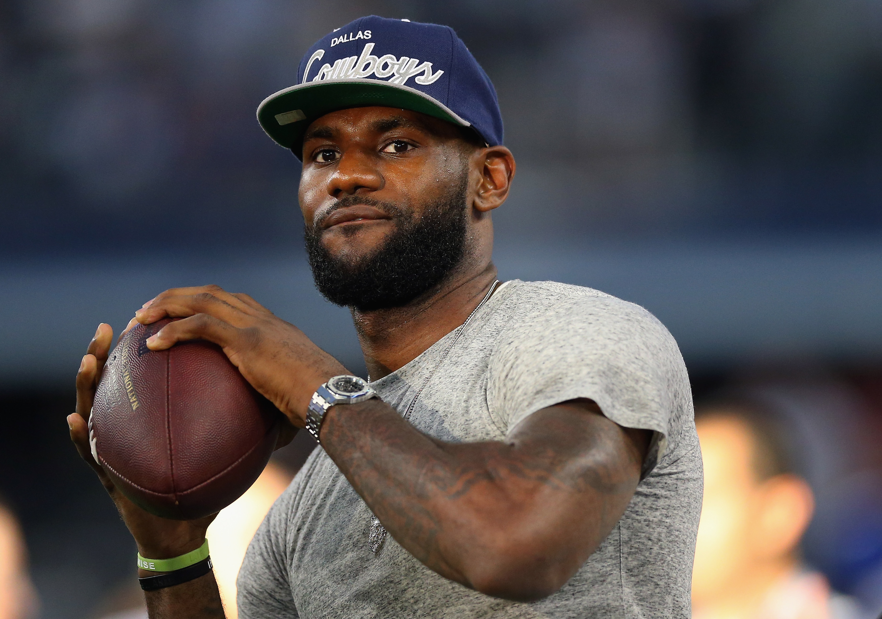 NBA superstar LeBron James gets to give football a try at AT&T Stadium on September 8, 2013 in Arlington, Texas. (Getty Images)