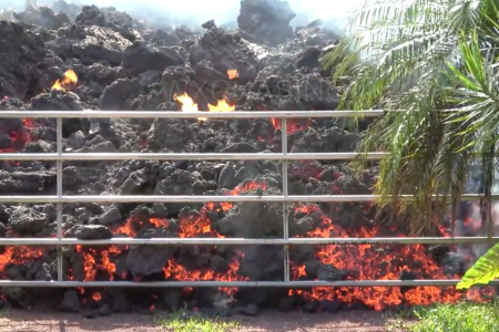 A still shot of lava destroying a gate on Hawaii's Big Island (Facebook video)