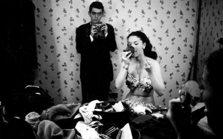 Stanley Kubrick was a LOOK magazine photographer when he caught himself in the mirror of Rosemary Williams, a showgirl, in 1949. LOOK Magazine Collection, Library of Congress, Prints & Photographs Division. (Courtesy of Wikimedia Commons)