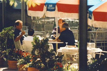 In this 1993 FBI surveillance photo, Francis "Cadillac Frank" Salemme, left, Stephen "The Rifleman" Flemmi, second from left with back to camera, and Frank Salemme Jr., behind right, are seated at The Charles Hotel in Cambridge, Mass. (FBI Surveillance Photo via AP)