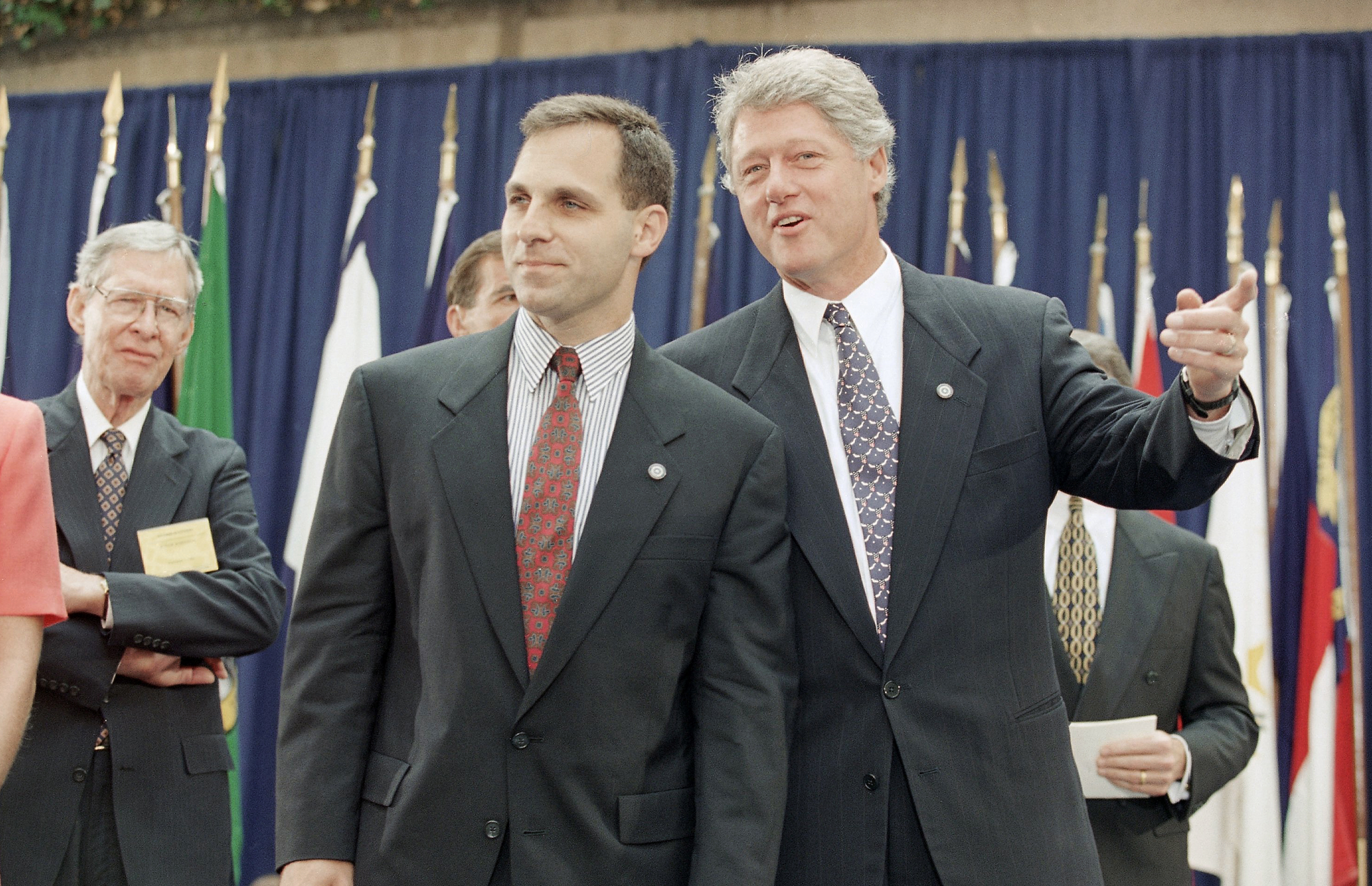 President Bill Clinton talks to FBI Director Louis Freeh during Freeh's swearing ceremony as director at FBI Headquarters in Washington on Sept. 1, 1993. (AP Photo/Wilfredo Lee)