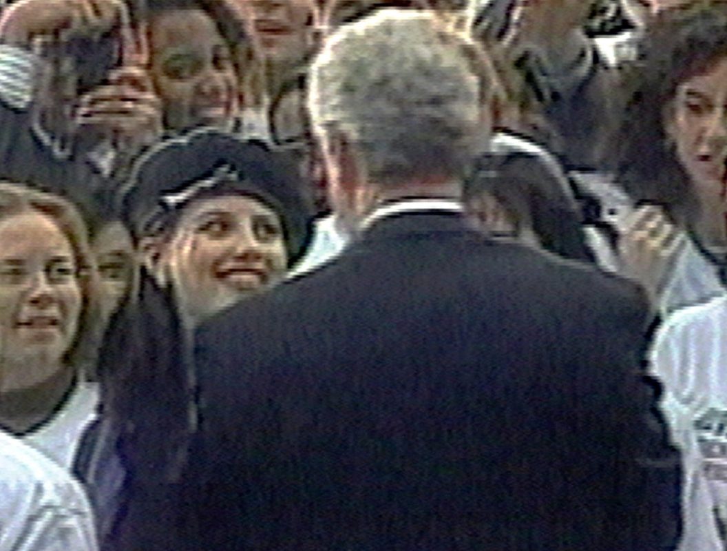 In this image taken from video, Monica Lewinsky (wearing beret) smiles at President Clinton as he greets well-wishers at a White House lawn party in Washington Nov. 6, 1996. (AP Photo/APTV)